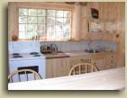 The kitchen in the Up Top log cabin